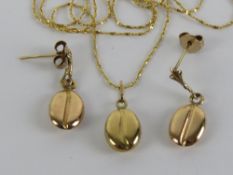 A 14ct gold chain necklace having 'coffee bean' pendant upon.
