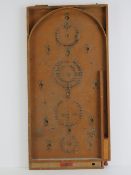 A Chad Valley Bagatelle board, 76cm.