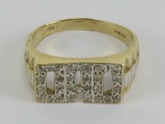 A 9ct gold ring 'Dad' in white stones, hallamrked 375, size X-Y, 5.8g.