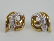 A pair of diamond 9ct white and yellow gold stud earrings, hallmarked 375,