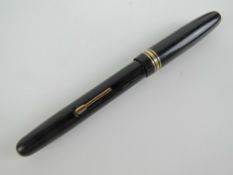 A Watermans 'Self filler' fountain pen having Watermans 14ct gold nib.