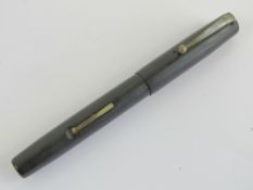 A vintage Mabie Todd Blackbird 'self-filler' fountain pen having Blackbird 14ct gold nib.