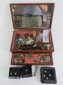 A wooden jewellery box having mirrored lid and lift out tray,