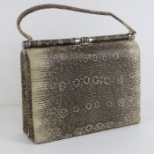 A vintage snake skin ladies handbag complete with python skin coin purse, 28cm wide.