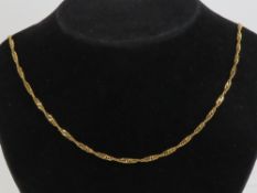 A HM 9ct gold twist double link chain necklace with hook clasp, hallmarked London and measuring 61.