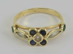 A floral ring set with sapphires and cz stones, no apparent hallmark, size K, 1.