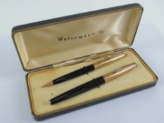 A box set Waterman's fountain pen having 14ct gold nib together with matching propelling pencil