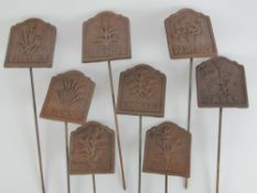 A quantity of cast iron garden herb markers inc chives, lavender, mint, sage, etc. Eight in total.