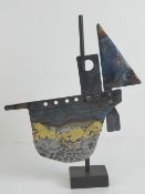 A handmade contemporary sculpture of a sailboat standing 33cm high.