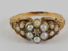 A Victorian diamond pearl and black enamel mourning ring,