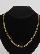 A 9ct gold flattened curb link chain necklace measuring 51cm in length, hallmarked 375. 31.3g.