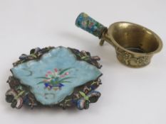 A brass and enamelled quatreform dish decorated with dragonflies and flowers upon, 12cm dia.