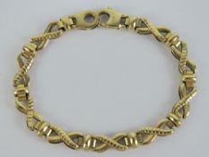 A 9ct gold articulated X-link and bar pattern bracelet, hallmarked 375,
