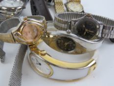 A large quantity of assorted men's and ladies wristwatches.