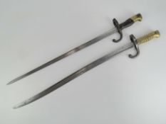 A Gras bayonet engraved to blade back with date 1877, hook quillion.