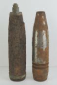 Two inert shells with heads in relic con