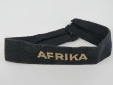 A WWII German Afrika cuff title, removed from a uniform, used condition.