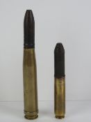 Two WWII German 20mm cannon shells, dated 1938 and 1939 respectively.