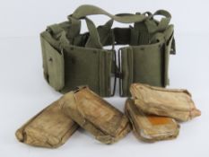 BAR magazine pouches on belt, containing four BAR magazines.