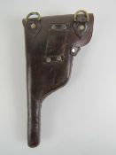 A reproduction Mauser 'broom handle' leather holster, dated 1915.