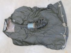 A rare WWII U.S. M1 Infants gas mask. Un-used condition with original paper instructions.