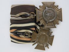 A WWII German 1914-18 Service Cross medal, together with a Ten Year Service Cross medal. Two items.