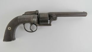 An antique British percussion transitional model revolver having markings and stamps upon.