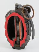 An inert Mills 36 grenade having cut-away section.