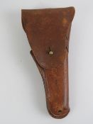 A Colt 1911 leather holster.