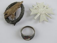 Two reproduction WWII German badges; crossed swords and Paratroopers.