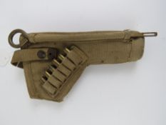 A WWII Enfield tankers revolver holster with six inert rounds and cleaning rod.