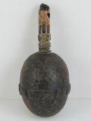An inert WWI German 'egg' grenade with fuse.