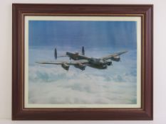 'Moonlight Return' a print of a painting by Gerald Palmer of a Lancaster bomber in flight,