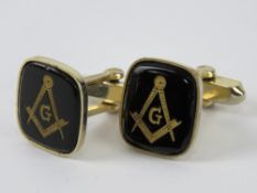 Masonic; pair of carved black onyx cufflinks having square and compass design upon.