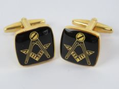 Masonic; A pair of Masonic cuff links having square and compass design upon.