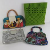 Four assorted handbags.