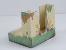 A Clarice Cliff cigarette holder with in