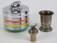 A 1960s table lighter in chrome having t