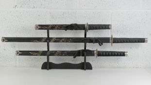 A trio of contemporary graduated katana'
