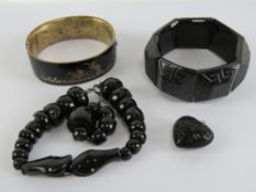 A Victorian black enamelled bangle havin