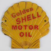 A cast metal wall plaque, 'Golden Shell