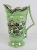 A green lustre Astoria pattern jug made