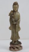 A carved soapstone Oriental figurine sta