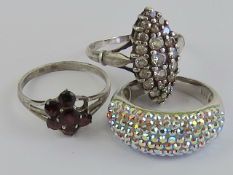 Three silver rings, one marquise shaped