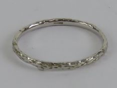 A 9ct white gold bark effect ring, hallm
