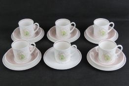 A set of five Susie Cooper trios each in
