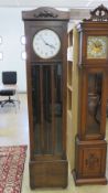 A c1930s stained oak long case hall cloc