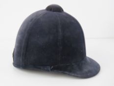 A velvet covered peak riding hat as made by S Patey, size 6 1/2.