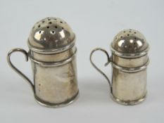 Two HM silver miniature pepperettes in the form of flour castors,