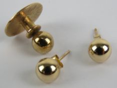 A pair of 9ct gold stud earrings, stamped 375, together with a 9ct gold shirt stud. Total weight 1.